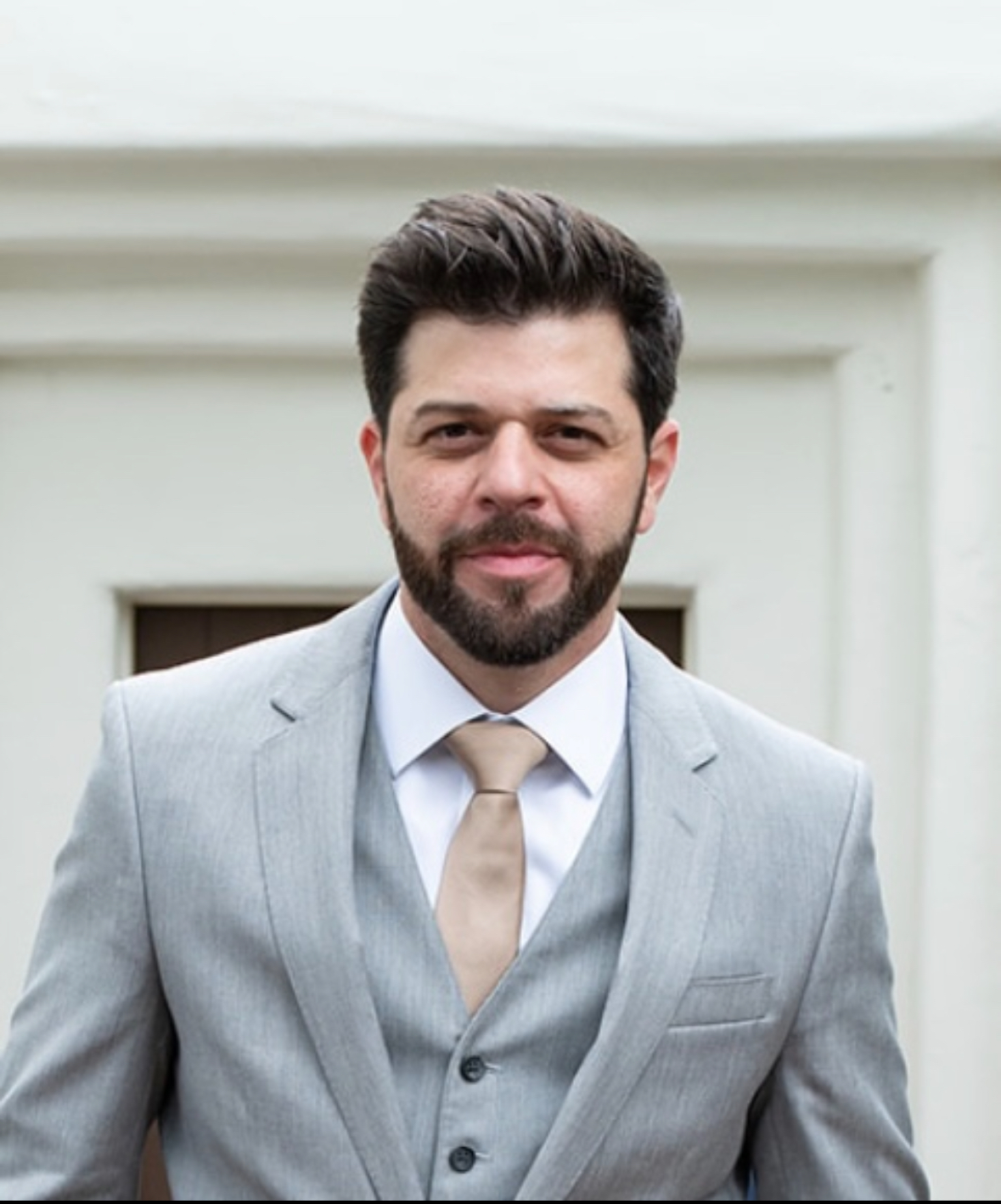 Sari Sabella in a gray three-piece suit